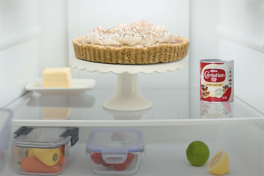 A still from the Carnation ad showing a can in the fridge next to a banoffee pie